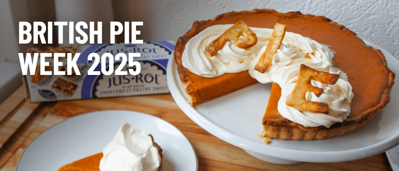 A sweet potato pie with cream and pastry letters spelling "pie" on a plate, celebrating British Pie Week 2025.